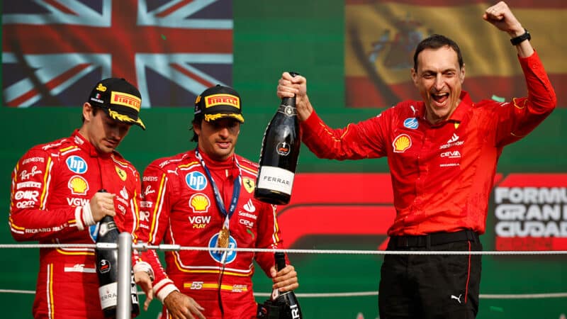 Ferrari race engineer Riccardo Adami celebrates on the podium with Carlos Sainz after victory in the 2024 F1 Mexico City Grand Prix