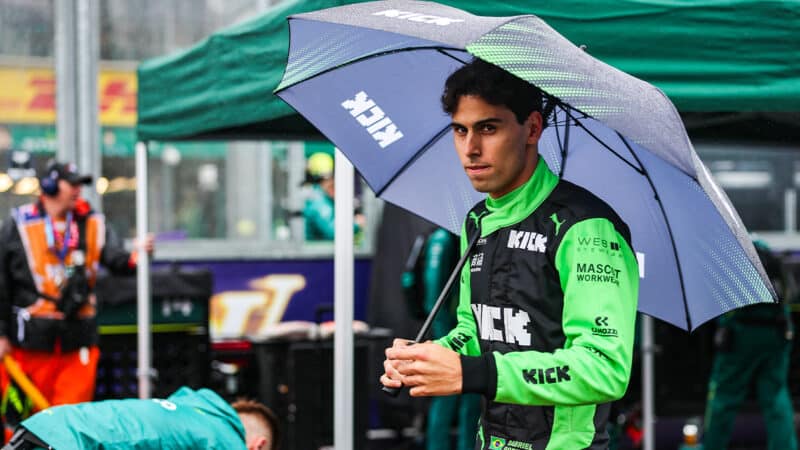 Gabriel Bortoleto holds umbrella on F1 grid at 2025 Australian Grand Prix