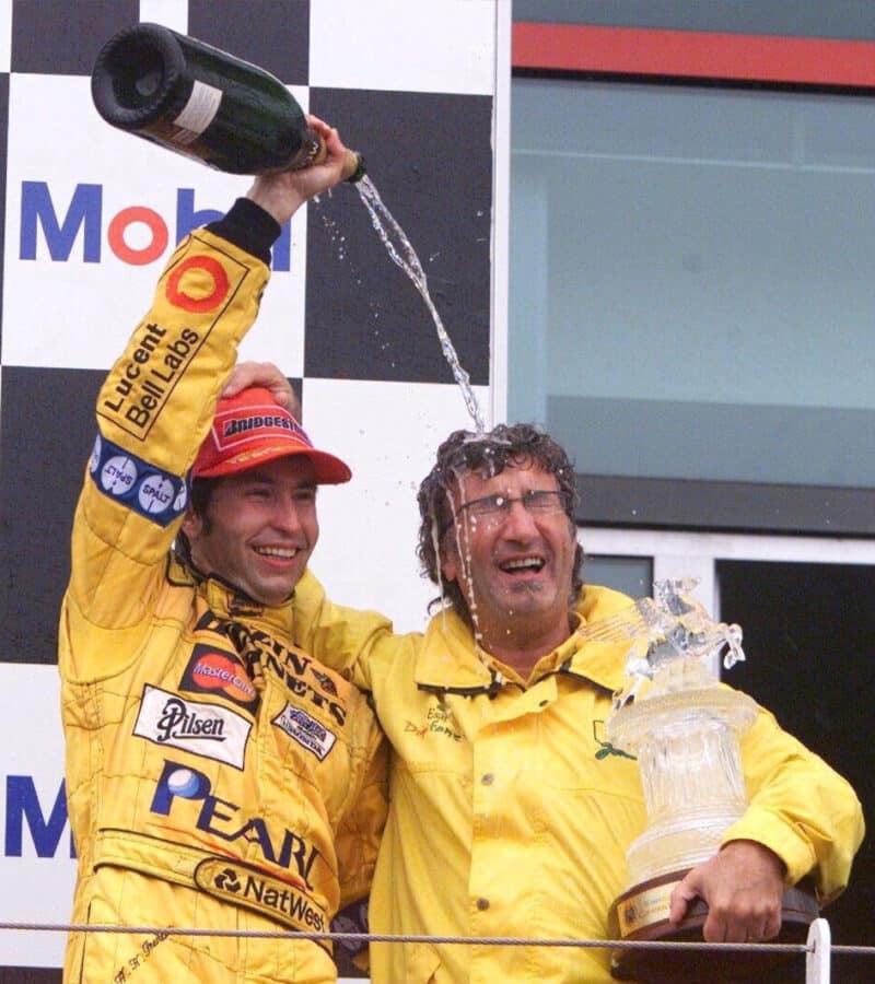 Heinz Harald Frentzen pours champagne over Eddie Jordan after 1999 French GP win