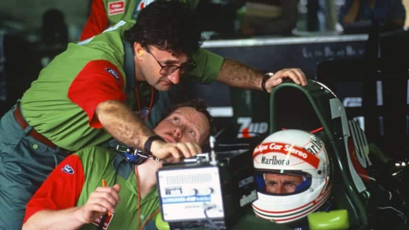 Jordan-Ford team principal Eddie Jordn, team manager Trevor Foster and Andrea de Cesaris in the pits during practice for the 1991 Brazilian Grand Prix in Interlagos. Photo: Grand Prix Photo