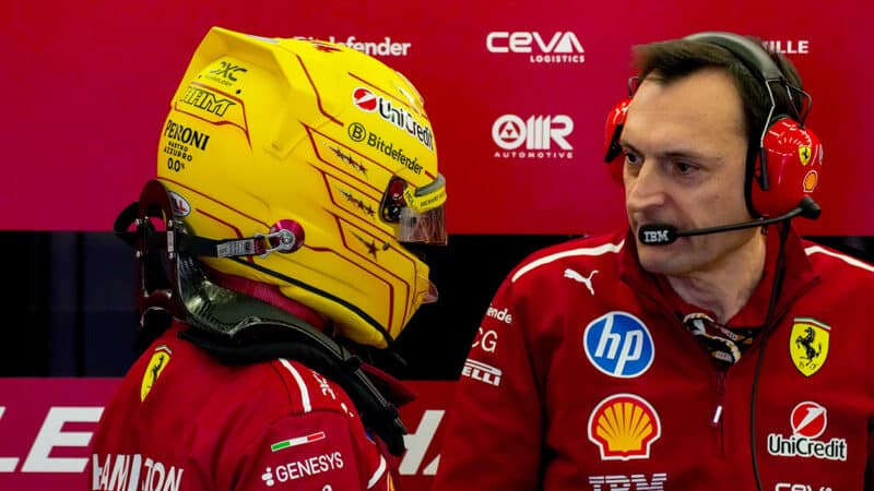 Riccardo Adami talks to Lewis Hamilton in Ferrari garage at 2025 F1 preseason testing